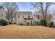 Expansive backyard view highlighting the home's exterior and patio area at 302 Roswell Green Ln, Roswell, GA 30075