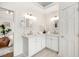 Elegant bathroom boasts dual sinks, white cabinetry, modern fixtures, and is complemented by soothing decor at 302 Roswell Green Ln, Roswell, GA 30075