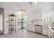 Bright kitchen with white cabinets, stainless dishwasher, and a view to the outside at 302 Roswell Green Ln, Roswell, GA 30075