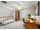 Home office with natural light, ceiling fan, bookshelf, and carpet at 302 Roswell Green Ln, Roswell, GA 30075