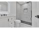Bathroom featuring a tiled walk-in shower, modern vanity and lighting at 5075 S Woodbridge Trl, Stone Mountain, GA 30088