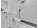This bathroom features a modern shower with black hardware and white marble-style tile at 5075 S Woodbridge Trl, Stone Mountain, GA 30088