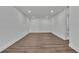 A spacious bedroom with recessed lighting and wood-look flooring. Ready for furnishings! at 5075 S Woodbridge Trl, Stone Mountain, GA 30088