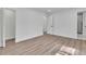 Bedroom featuring an open doorway, a large closet, and luxury vinyl plank flooring at 5075 S Woodbridge Trl, Stone Mountain, GA 30088