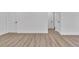 Neutral interior showcasing wood-look floors, white baseboards and crisp, white walls at 5075 S Woodbridge Trl, Stone Mountain, GA 30088
