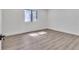 Bedroom with plank flooring and a window allowing for ample natural light at 5075 S Woodbridge Trl, Stone Mountain, GA 30088