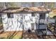 Exterior showcasing a deck, neutral siding, and a well-maintained yard at 5075 S Woodbridge Trl, Stone Mountain, GA 30088