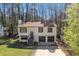 Well-maintained two-story home with a charming exterior, inviting curb appeal, and attached garage at 5075 S Woodbridge Trl, Stone Mountain, GA 30088