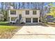 Inviting two-story home with a two-car garage and well-maintained front yard at 5075 S Woodbridge Trl, Stone Mountain, GA 30088