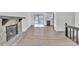 Open-concept living room with a fireplace flowing into a modern kitchen at 5075 S Woodbridge Trl, Stone Mountain, GA 30088