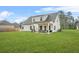 Spacious backyard featuring a covered patio area and grill, ideal for outdoor gatherings at 6441 Oakhurst Pl, Fairburn, GA 30213