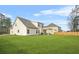 Large backyard with a covered patio and grill, offering ample space for relaxation and entertainment at 6441 Oakhurst Pl, Fairburn, GA 30213