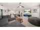Cozy carpeted bonus room with ample seating, desk, and good lighting at 6441 Oakhurst Pl, Fairburn, GA 30213