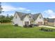 A charming two-story home with a well-kept lawn, an attached garage, and a pleasant suburban aesthetic at 6441 Oakhurst Pl, Fairburn, GA 30213