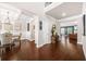 Grand foyer showcasing hardwood floors, coffered ceilings, with views into a living and dining area at 6441 Oakhurst Pl, Fairburn, GA 30213