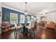 Inviting living room featuring a glass-top table, hardwood floors, and an open layout at 6441 Oakhurst Pl, Fairburn, GA 30213