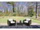 Cozy patio features outdoor seating, perfect for relaxing and enjoying the backyard view at 8212 Englewood Trl, Riverdale, GA 30274