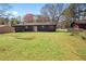 Grassy backyard provides plenty of space for outdoor activities and recreation at 8212 Englewood Trl, Riverdale, GA 30274