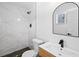 Bathroom boasts modern fixtures, luxurious shower, and stylish vanity at 8212 Englewood Trl, Riverdale, GA 30274