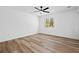 This bedroom has lots of light with wood floors and neutral paint at 8212 Englewood Trl, Riverdale, GA 30274