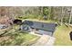 Aerial view of a charming single-story home with a well-maintained lawn and an inviting front entrance at 8212 Englewood Trl, Riverdale, GA 30274