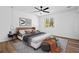 This main bedroom boasts a spacious layout, modern furnishings, and wood floors at 8212 Englewood Trl, Riverdale, GA 30274