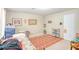 Bright bedroom featuring neutral walls, a patterned rug, and ample space for versatile use at 1138 Alford Rd, Lithonia, GA 30058