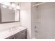 Bathroom features a white tub and a modern gray vanity at 2090 Sand Wedge Nw Cir, Kennesaw, GA 30144