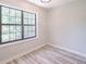 Neutral bedroom with hardwood floors and large window at 2090 Sand Wedge Nw Cir, Kennesaw, GA 30144
