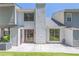 Exterior showcasing a patio with access to the house and a well-manicured lawn at 2090 Sand Wedge Nw Cir, Kennesaw, GA 30144