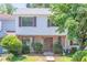 Charming two-story home with brick facade, complemented by lush greenery and inviting curb appeal at 2090 Sand Wedge Nw Cir, Kennesaw, GA 30144