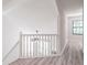 Hallway overlooking living room with wood floors and white railing at 2090 Sand Wedge Nw Cir, Kennesaw, GA 30144