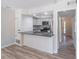 Bright kitchen features granite countertops, white cabinets, and stainless steel appliances at 2090 Sand Wedge Nw Cir, Kennesaw, GA 30144
