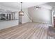 Large living room with modern features, wooden floors, and access to the kitchen at 2090 Sand Wedge Nw Cir, Kennesaw, GA 30144