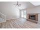 Spacious living room featuring a brick fireplace and large windows at 2090 Sand Wedge Nw Cir, Kennesaw, GA 30144