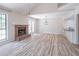 Bright living room boasts wood floors, brick fireplace and vaulted ceiling at 2090 Sand Wedge Nw Cir, Kennesaw, GA 30144
