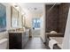 Refined bathroom featuring dual sinks, granite counters, a soaking tub, and contemporary finishes at 1080 Peachtree Ne St # 2005, Atlanta, GA 30309