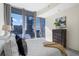 Stylish bedroom offers comfortable living with modern decor and stunning city views through large windows at 1080 Peachtree Ne St # 2005, Atlanta, GA 30309