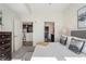 Relaxing bedroom with plush bedding, an open doorway to a kitchen and stylish decor throughout at 1080 Peachtree Ne St # 2005, Atlanta, GA 30309