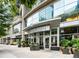 Inviting building entrance with modern architecture, lush greenery, and clear signage, ensuring a welcoming arrival at 1080 Peachtree Ne St # 2005, Atlanta, GA 30309