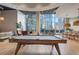Community clubhouse featuring billiards, lounge seating and city views from large windows at 1080 Peachtree Ne St # 2005, Atlanta, GA 30309