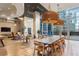 Modern clubhouse with a long dining table, lounge seating and views of the city at 1080 Peachtree Ne St # 2005, Atlanta, GA 30309