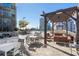 Outdoor dining area includes tables and comfortable seating to entertain guests at 1080 Peachtree Ne St # 2005, Atlanta, GA 30309