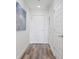 Bright hallway with wood-style floors leads to a front door, offering a welcoming entrance at 1080 Peachtree Ne St # 2005, Atlanta, GA 30309