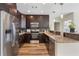 Well-equipped kitchen boasts stainless steel appliances, granite countertops, and dark cabinets, creating a sleek design at 1080 Peachtree Ne St # 2005, Atlanta, GA 30309