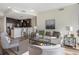 Bright living area showcases modern kitchen, comfortable seating, and expansive windows offering stunning cityscape views at 1080 Peachtree Ne St # 2005, Atlanta, GA 30309