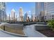 Chic outdoor seating area with comfortable chairs and modern umbrellas, ideal for enjoying the city views at 1080 Peachtree Ne St # 2005, Atlanta, GA 30309