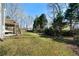 Serene backyard with mature trees, deck, and stairs at 1129 Annie Sw Ln, Mableton, GA 30126