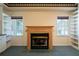 Finished basement with a cozy fireplace, shelving and natural light for a comfortable living space at 1129 Annie Sw Ln, Mableton, GA 30126
