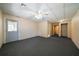 Wide open basement with light tan walls, carpeting and drop ceiling, perfect for creating a flexible living area at 1129 Annie Sw Ln, Mableton, GA 30126